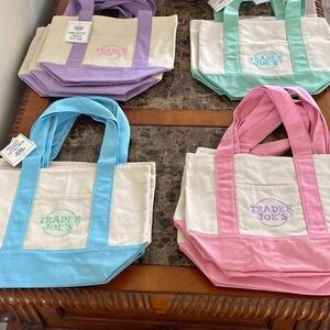 - Trader Joe’s, 2025 spring tote bag You Get 1 Purple New 13”x11”
